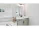 Light, bright bathroom featuring modern vanity with tub in background at 772 Mirkwood Ave, Apex, NC 27523