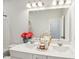 Bathroom featuring dual sinks, modern fixtures, granite countertop, and designer finishes at 772 Mirkwood Ave, Apex, NC 27523