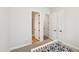 Spare bedroom with open doors to the bathroom and closet at 772 Mirkwood Ave, Apex, NC 27523