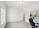 Bright bedroom with neutral walls, carpet, natural light, closet and entry to the on-suite bathroom at 772 Mirkwood Ave, Apex, NC 27523