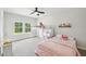 Bright bedroom with a bunk bed and natural light from the window at 772 Mirkwood Ave, Apex, NC 27523