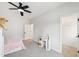 Bedroom with a bunk bed, fan, and desk featuring access to the walk-in closet at 772 Mirkwood Ave, Apex, NC 27523