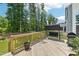 Spacious wooden deck with a swing, grill, and views of the lush backyard at 772 Mirkwood Ave, Apex, NC 27523