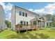 Back of the house with a deck and screened in porch and a view of the large back yard at 772 Mirkwood Ave, Apex, NC 27523