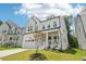 Beautiful two-story home showcasing a well-kept lawn and inviting covered front porch at 772 Mirkwood Ave, Apex, NC 27523