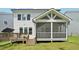 View of the back of the house highlighting the screened-in porch and wood deck at 772 Mirkwood Ave, Apex, NC 27523
