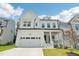 Charming new construction home featuring a two-car garage, covered porch, and manicured lawn at 772 Mirkwood Ave, Apex, NC 27523