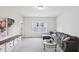 Spacious living room featuring a sectional sofa and large windows at 772 Mirkwood Ave, Apex, NC 27523