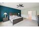 This main bedroom features paneled accent wall, ceiling fan, and neutral color palette at 772 Mirkwood Ave, Apex, NC 27523
