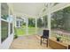 Relaxing screened porch offering views of the backyard and ample space for outdoor seating at 772 Mirkwood Ave, Apex, NC 27523