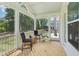 Spacious screened porch with outdoor seating and scenic views of the landscaped backyard at 772 Mirkwood Ave, Apex, NC 27523