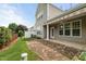 Home's backyard patio features an awning that provides a shaded outdoor retreat at 7873 Cape Charles Dr, Raleigh, NC 27617