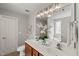Bathroom featuring a double sink vanity with framed mirror and decorative accents at 7873 Cape Charles Dr, Raleigh, NC 27617