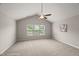 Bright, carpeted bedroom with three windows and a vaulted ceiling featuring a ceiling fan at 7873 Cape Charles Dr, Raleigh, NC 27617
