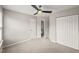 This cozy bedroom features neutral walls, carpet floors, and double door closets for optimal storage at 7873 Cape Charles Dr, Raleigh, NC 27617