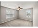This bright, spacious bedroom features neutral walls, carpet floors, and large windows, creating a serene atmosphere at 7873 Cape Charles Dr, Raleigh, NC 27617