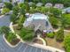 Aerial view of the community pool, showing parking, clubhouse, and surrounding neighborhood at 7873 Cape Charles Dr, Raleigh, NC 27617