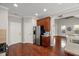 Kitchen with stainless steel refrigerator and appliances, and wood cabinets at 7873 Cape Charles Dr, Raleigh, NC 27617