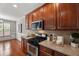 Close up of kitchen featuring stainless steel appliances and granite countertops at 7873 Cape Charles Dr, Raleigh, NC 27617