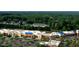 Shopping center surrounded by parking and trees in a suburban neighborhood at 804 Town Side Dr, Apex, NC 27502