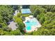 Aerial view showcasing the community pool, tennis courts, and surrounding greenery at 804 Town Side Dr, Apex, NC 27502