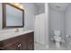 Clean and well-lit bathroom featuring a vanity, modern fixtures, and a shower with a curtain at 804 Town Side Dr, Apex, NC 27502
