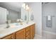 Bright bathroom with double sinks, ample counter space, and large mirror at 804 Town Side Dr, Apex, NC 27502