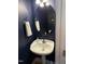 Charming half bathroom with stylish oval mirror and pedestal sink at 804 Town Side Dr, Apex, NC 27502
