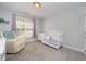 Bright and spacious bedroom with large window and comfortable seating area at 804 Town Side Dr, Apex, NC 27502