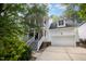 Charming two-story home with a double porch, two-car garage, and lush landscaping at 804 Town Side Dr, Apex, NC 27502