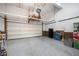 Organized garage with epoxy flooring and a storage system, ideal for parking and storage at 804 Town Side Dr, Apex, NC 27502