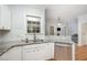 Well-lit kitchen featuring stainless steel appliances and white subway tile backsplash at 804 Town Side Dr, Apex, NC 27502