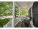 Relaxing porch with rocking chairs and white columns, providing a serene outdoor space at 804 Town Side Dr, Apex, NC 27502