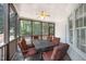 Inviting screened porch with outdoor dining set, perfect for enjoying nature at 804 Town Side Dr, Apex, NC 27502