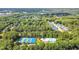 Overhead shot featuring tennis, basketball, and pool facilities with the residential neighborhood in distance at 804 Town Side Dr, Apex, NC 27502