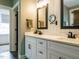 Bright bathroom features double sinks, quartz countertops and black hardware at 83 Sawyer Ct, Wendell, NC 27591
