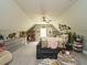Spacious bedroom with a charming attic ceiling, a relaxing seating area, and ample natural light at 83 Sawyer Ct, Wendell, NC 27591