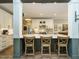 Stylish kitchen featuring a large island with seating and modern white cabinetry at 83 Sawyer Ct, Wendell, NC 27591