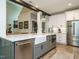 Modern kitchen featuring stainless steel appliances, a farm sink, and an open design at 83 Sawyer Ct, Wendell, NC 27591