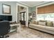 Comfortable living room featuring a desk, sofa, and large window bringing in plenty of natural light at 83 Sawyer Ct, Wendell, NC 27591