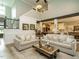 Bright and airy living room with comfortable sofas, hardwood floors, and natural light at 83 Sawyer Ct, Wendell, NC 27591