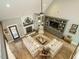 Bright living room boasting modern furnishings, a brick fireplace, and built-in shelving at 83 Sawyer Ct, Wendell, NC 27591