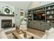 Spacious living room featuring a fireplace, built-in shelving, and comfortable seating for relaxation at 83 Sawyer Ct, Wendell, NC 27591