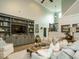 Spacious living room with built-in shelving, comfortable sofas, and a vaulted ceiling at 83 Sawyer Ct, Wendell, NC 27591