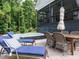 Inviting outdoor space with a hot tub, comfortable lounge chairs, and an elegant dining set for entertaining at 83 Sawyer Ct, Wendell, NC 27591