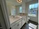 Bathroom features a double sink vanity with two large sinks and a window at 88 Willow Cameron Way, Angier, NC 27501