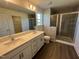 Bathroom features a double sink vanity and tiled shower at 88 Willow Cameron Way, Angier, NC 27501