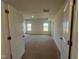 Bedroom features neutral carpet and two windows at 88 Willow Cameron Way, Angier, NC 27501