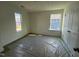 Sun-lit bedroom featuring two windows and closet with classic doors at 88 Willow Cameron Way, Angier, NC 27501