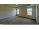 Bright bedroom with carpet and two windows at 88 Willow Cameron Way, Angier, NC 27501